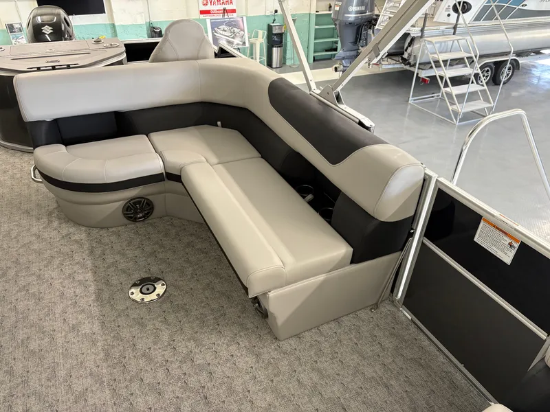Slide: The Image of 2025 South Bay 222FCR pontoon boat interior with plush seating and modern design. - 13