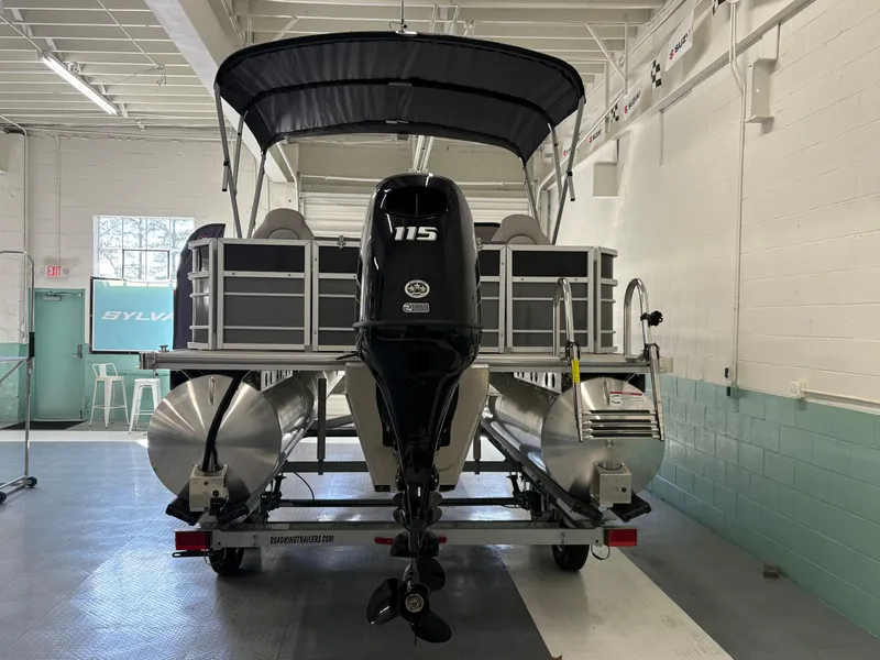 Slide: The Image of 2025 South Bay 222FCR pontoon boat with 115 HP engine in a showroom. - 3