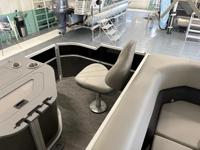 Slide: The Image of Interior of 2025 South Bay 222FCR pontoon boat with seating and control console. - 8