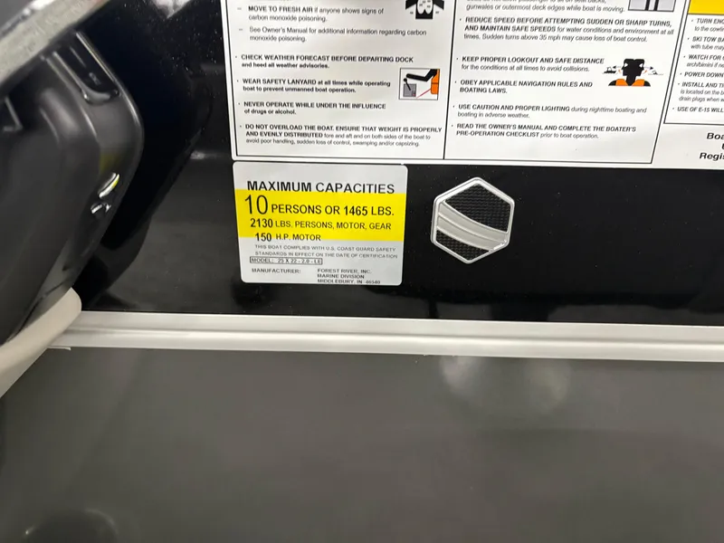 Slide: The Image of 2025 South Bay 222FCR capacity label: 10 persons, 1465 lbs, 2130 lbs with motor, 150 HP max. - 9