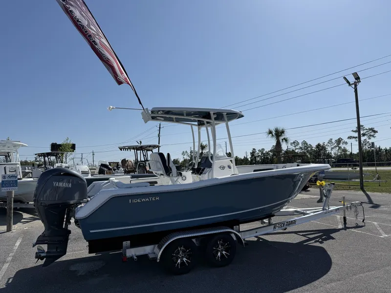 Slide: The Image of 2025 Tidewater 220 LXF boat on trailer, displayed outdoors with Yamaha engine. - 3