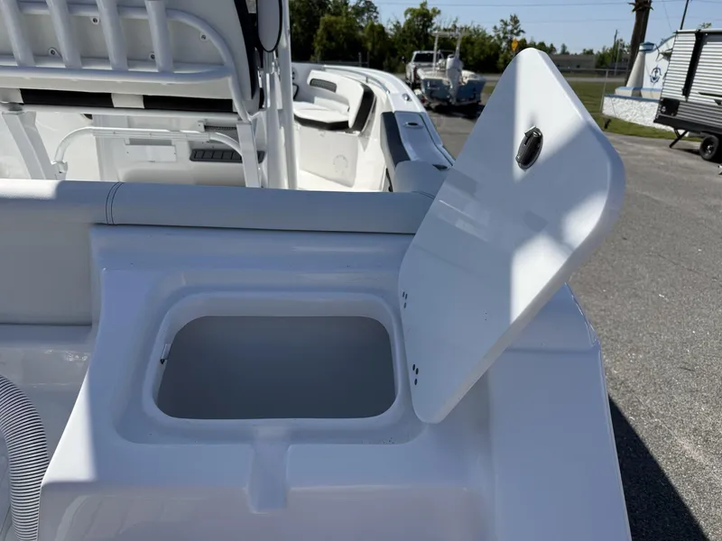 Slide: The Image of 2025 Tidewater 220 LXF boat interior with open storage compartment. - 5