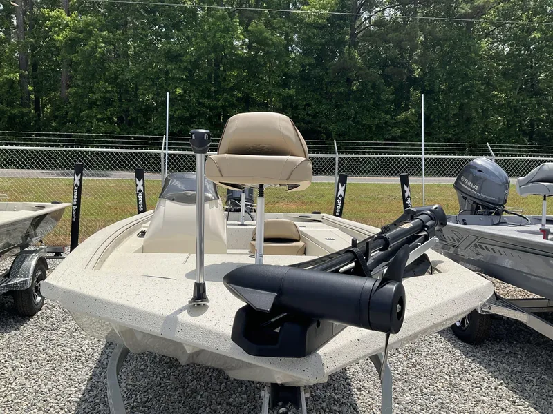 Slide: The Image of 2024 Xpress Xplorer Series XP170 boat with motor, displayed outdoors on gravel. - 3