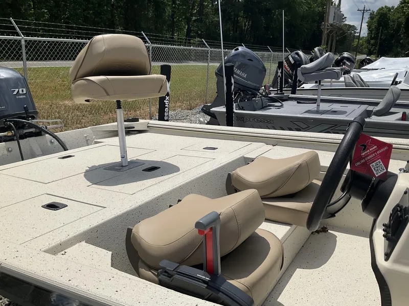 Slide: The Image of 2024 Xpress Xplorer Series XP170 boat with beige seating and Yamaha outboard motor. - 6
