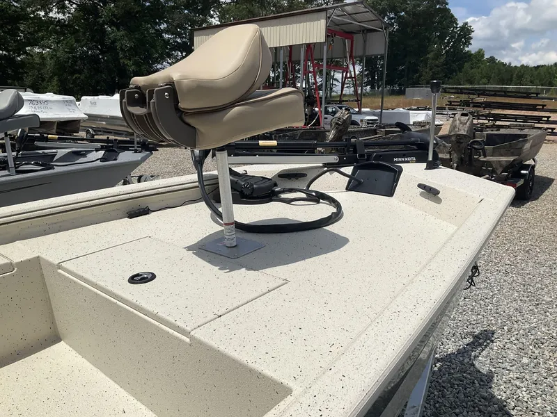 Slide: The Image of 2024 Xpress Xplorer Series XP170 boat with beige seat and Minn Kota trolling motor. - 7
