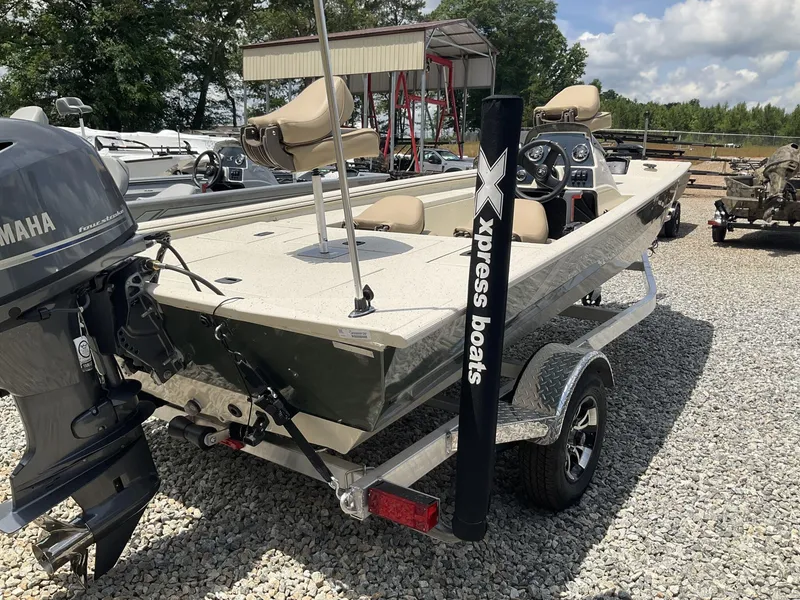 Slide: The Image of 2024 Xpress Xplorer Series XP170 boat with Yamaha outboard motor on gravel lot. - 9