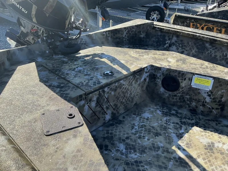 Slide: The Image of 2025 Excel Viper F4 1554 ECLIPSE boat interior with camouflage design and Tohatsu motor. - 6