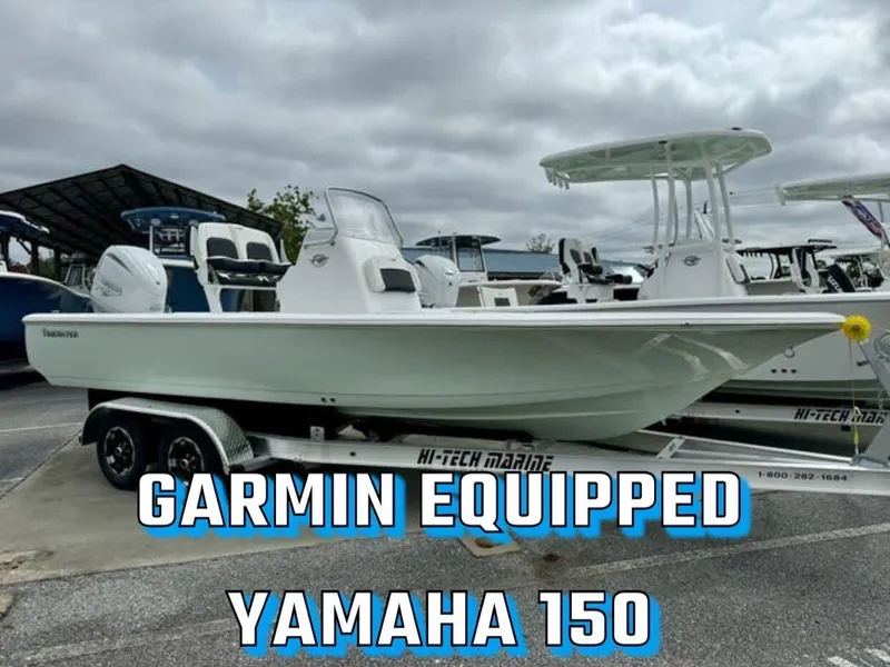 Slide: The Image of 2025 Tidewater 2110 Bay Max boat with Garmin equipment and Yamaha 150 engine on trailer. - 2