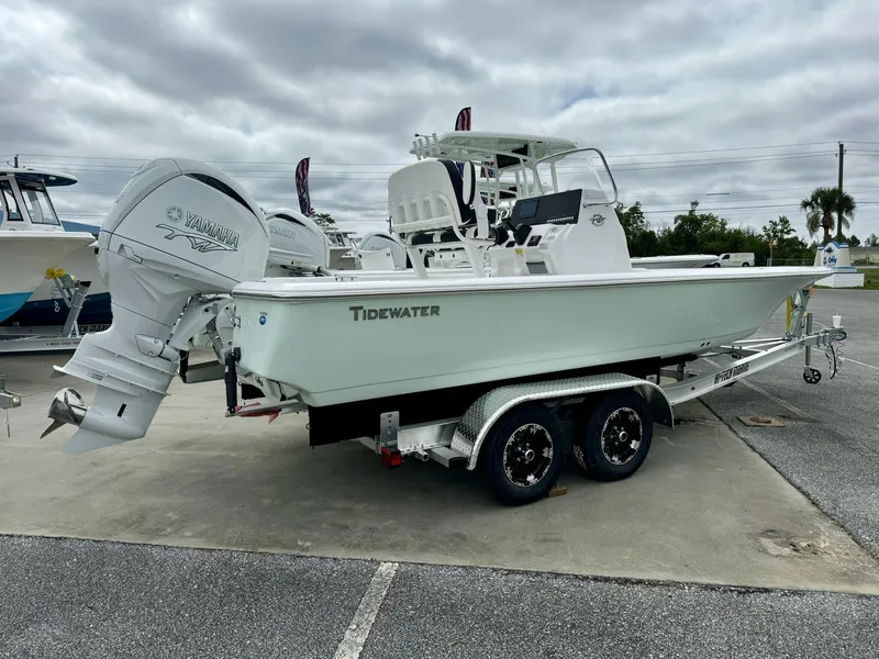 Slide: The Image of 2025 Tidewater 2110 Bay Max boat on trailer with Yamaha engine, parked outdoors. - 4