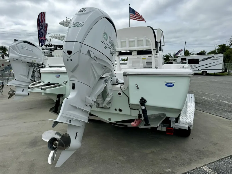 Slide: The Image of 2025 Tidewater 2110 Bay Max boat with Yamaha outboard motor, displayed outdoors. - 8