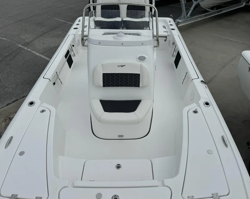 Slide: The Image of 2025 Tidewater 2110 Bay Max boat interior with seating and console. - 9
