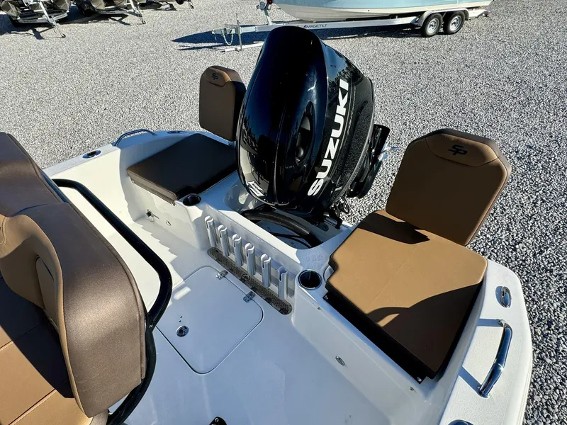 Slide: The Image of 2025 Sea Pro 202 boat with Suzuki engine, featuring brown seating and rod holders. - 5