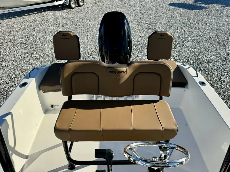 Slide: The Image of 2025 Sea Pro 202 boat interior with tan seating and steering wheel. - 6