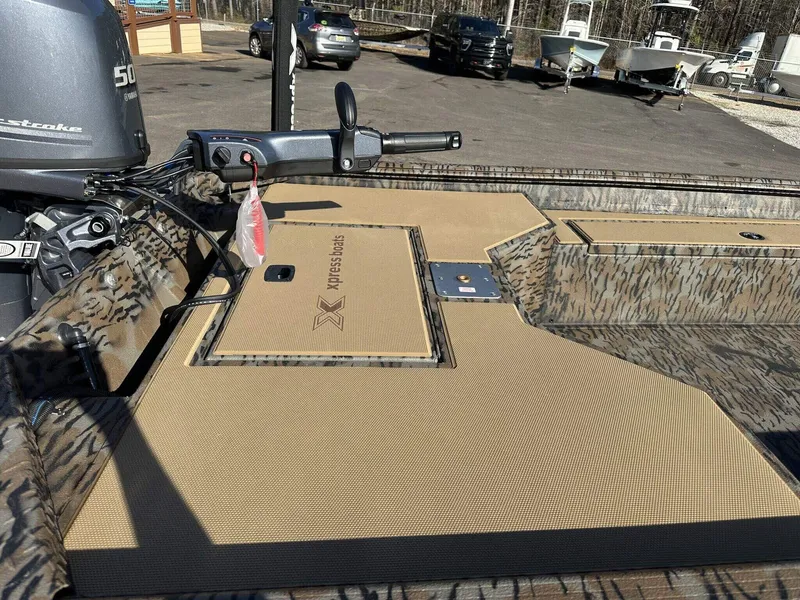 Slide: The Image of 2025 Xpress HD16DB boat with Seadeck and livewell, featuring a Yamaha outboard motor. - 6