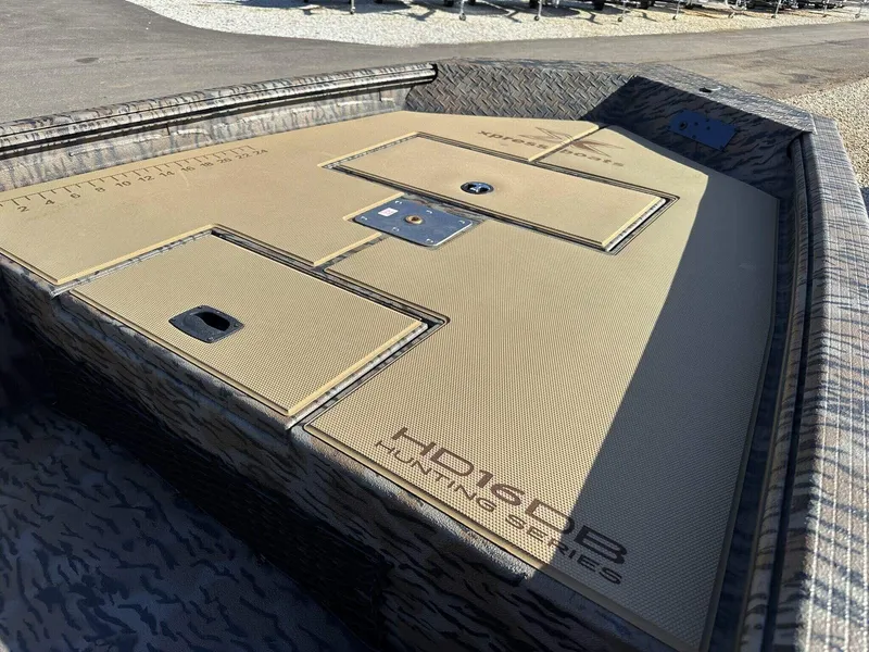 Slide: The Image of 2025 Xpress HD Series HD16DB boat with Seadeck and livewell, featuring a camo design. - 9