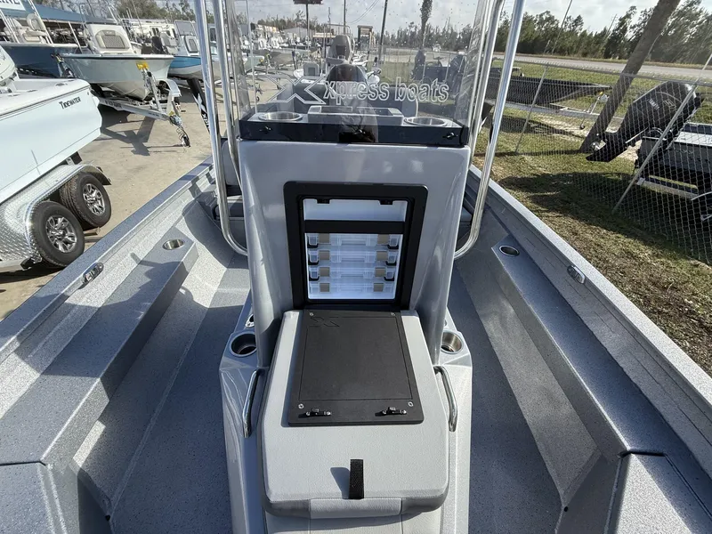 Slide: The Image of 2025 Xpress Hyper-Lift Series H20B boat console with storage compartments, displayed outdoors. - 7