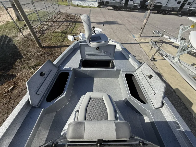 Slide: The Image of 2025 Xpress Hyper-Lift Series H20B boat with open storage compartments and seating. - 8