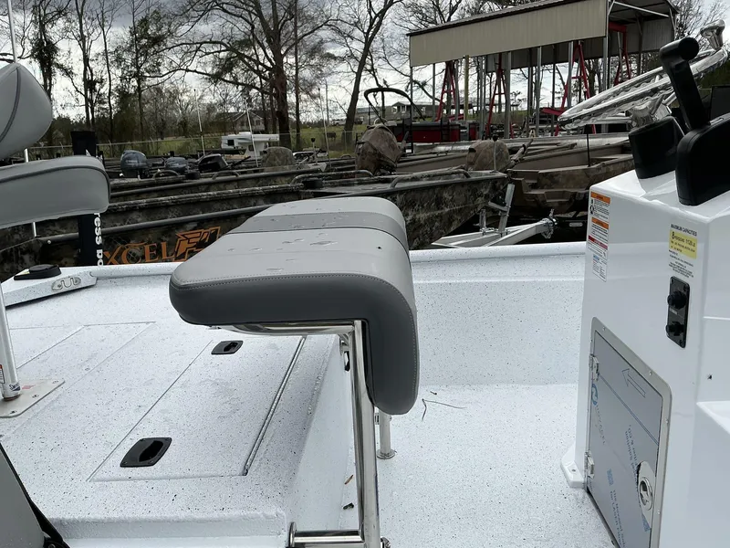 Slide: The Image of 2025 Xpress Xplorer Series XP20CC boat interior with seating and control panel. - 5