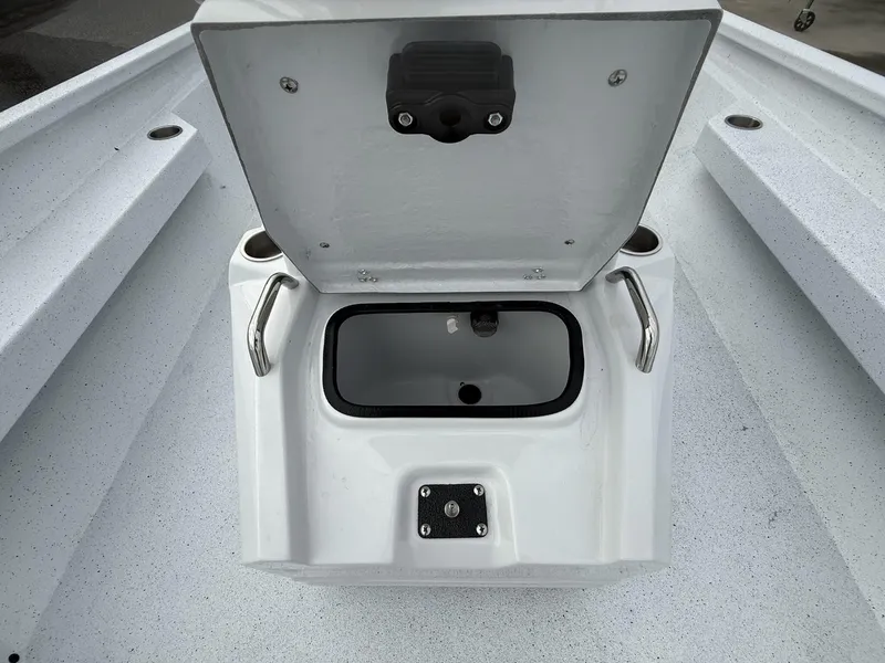 Slide: The Image of 2025 Xpress Hyper-Lift Series H22B boat storage compartment with open lid and handles. - 5