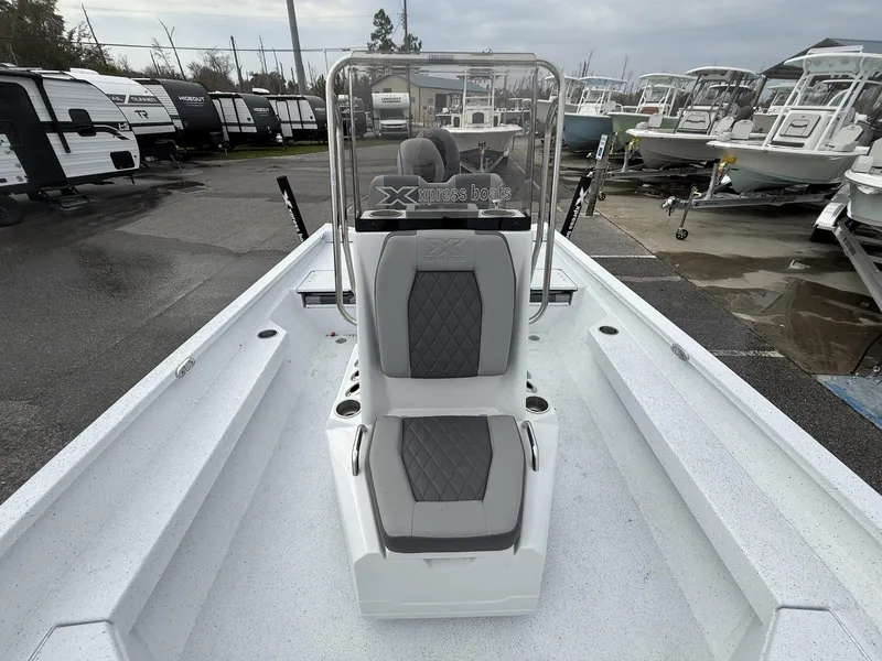 Slide: The Image of 2025 Xpress Hyper-Lift Series H22B boat interior with gray seating and console. - 6
