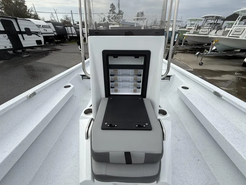 Slide: The Image of 2025 Xpress Hyper-Lift Series H22B boat interior with storage compartment open. - 7