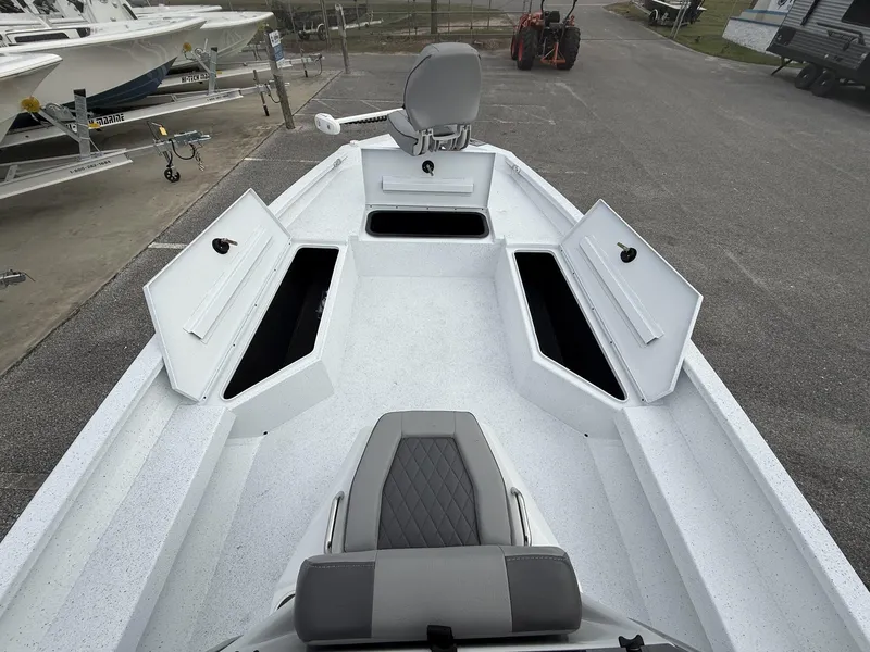 Slide: The Image of 2025 Xpress Hyper-Lift Series H22B boat interior with open storage compartments. - 8