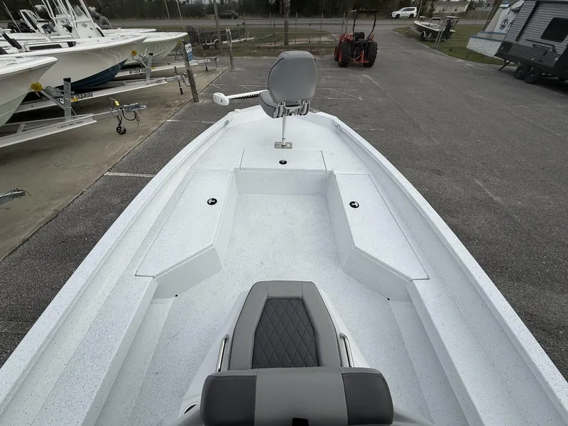 Slide: The Image of 2025 Xpress Hyper-Lift Series H22B boat interior with seating and storage compartments. - 9
