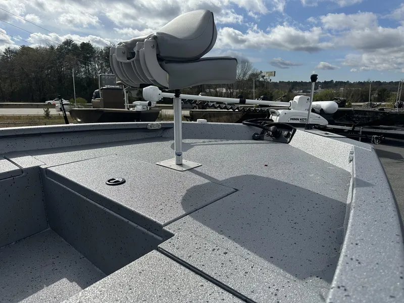 Slide: The Image of 2025 Xpress Hyper-Lift Series H22B boat deck with seat and trolling motor. - 4