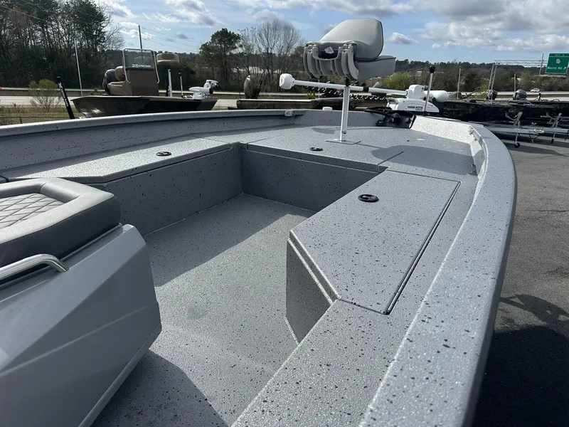 Slide: The Image of 2025 Xpress Hyper-Lift Series H22B boat interior with seating and storage compartments. - 5