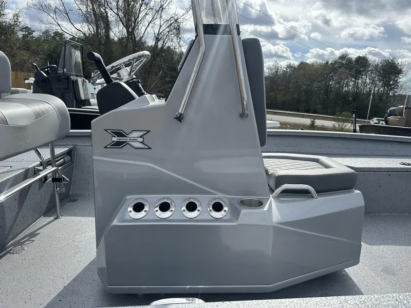 Slide: The Image of 2025 Xpress Hyper-Lift Series H22B boat interior with console and seating. - 6