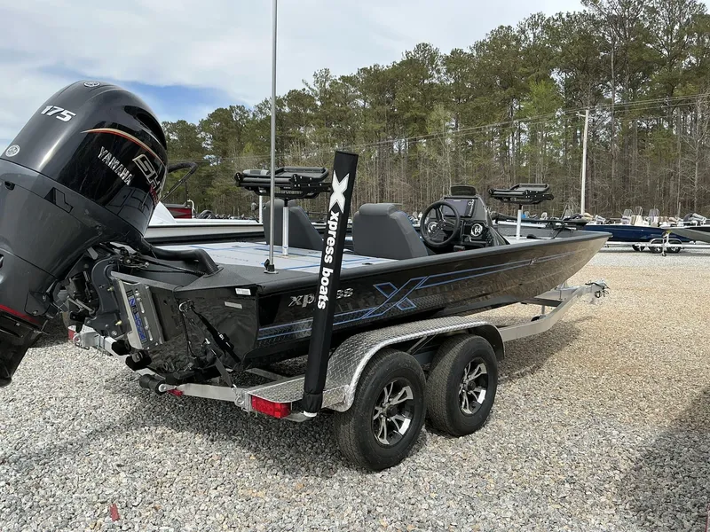 Slide: The Image of 2025 Xpress Hyper-Lift Crappie Series H20 boat with Yamaha 175 engine on trailer. - 9