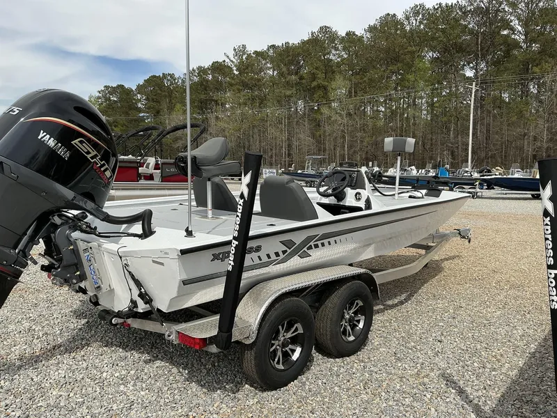 Slide: The Image of 2025 Xpress Hyper-Lift Bass Series boat with Yamaha engine on trailer. - 11