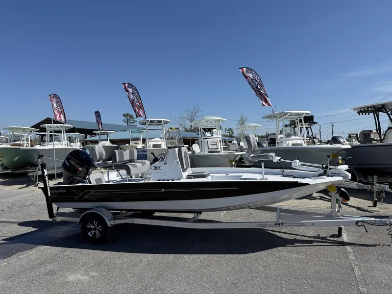 Slide: The Image of 2025 Xpress Hyper-Lift Series H20B boat on trailer, displayed outdoors under clear sky. - 1