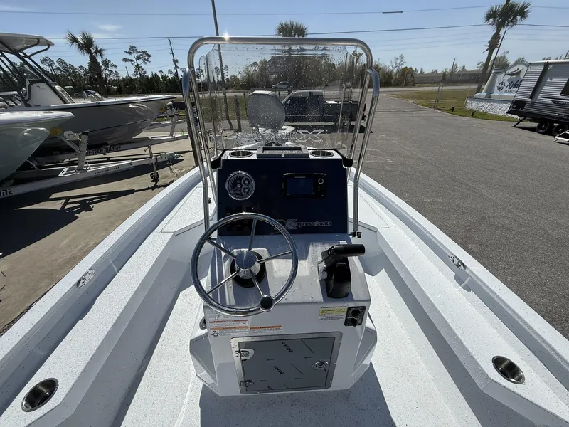 Slide: The Image of 2025 Xpress Hyper-Lift Series H20B boat console with steering wheel and controls. - 5