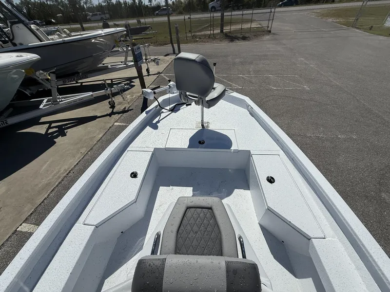 Slide: The Image of 2025 Xpress Hyper-Lift Series H20B boat with new console, parked on pavement. - 7