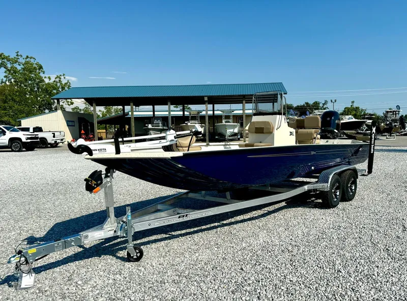 Slide: The Image of 2025 Xpress Shallow Water Series SW22B boat on trailer in outdoor setting. - 2