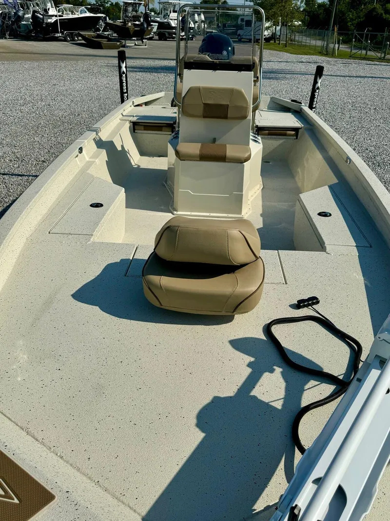 Slide: The Image of 2025 Xpress Shallow Water Series SW22B boat interior with seating and console. - 4
