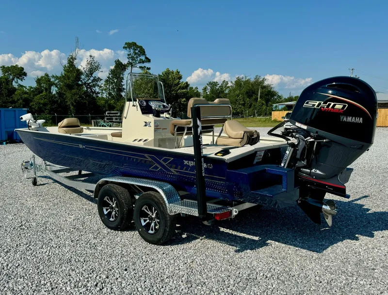 Slide: The Image of 2025 Xpress Shallow Water Series SW22B boat with Yamaha engine on trailer. - 7