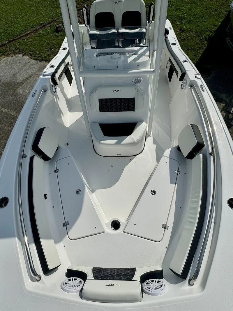 Slide: The Image of 2025 Tidewater 210 LXF boat interior with seating and storage compartments. - 4