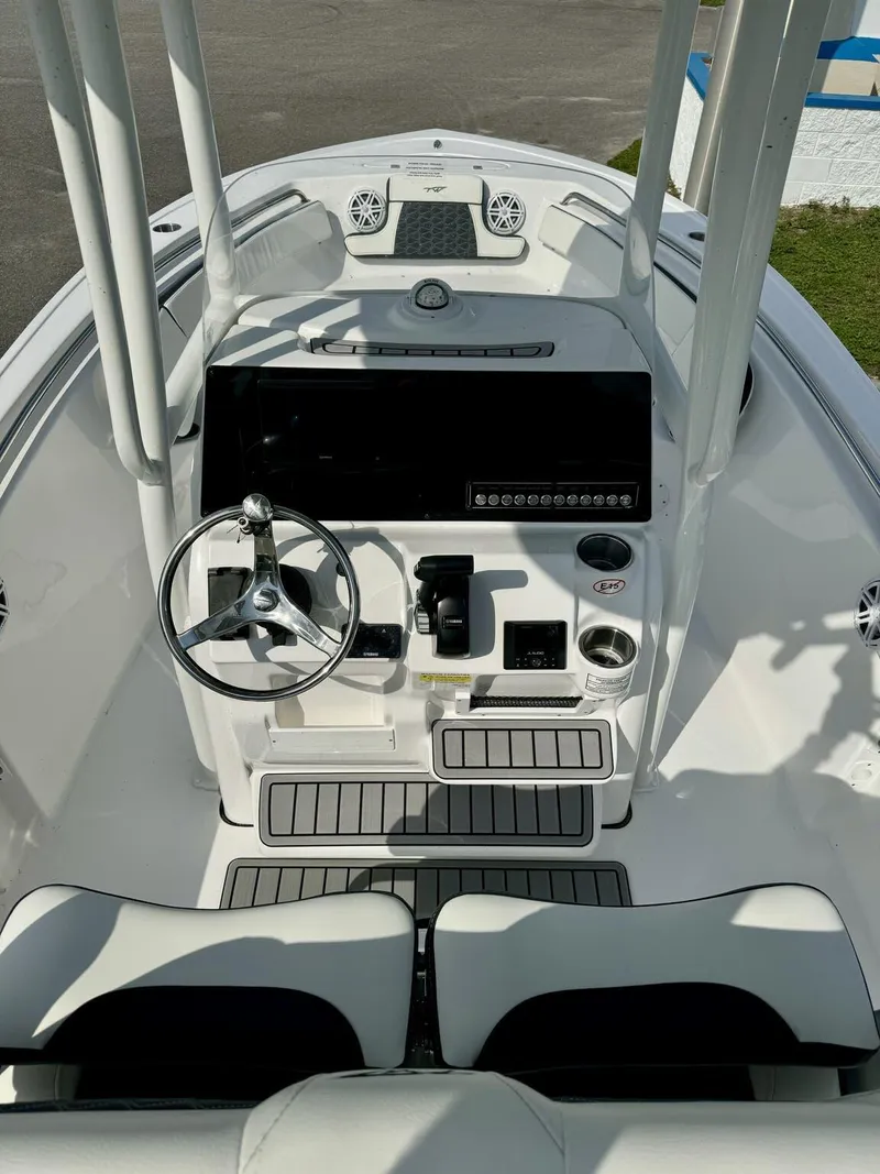 Slide: The Image of 2025 Tidewater 210 LXF boat cockpit with modern steering and controls. - 6