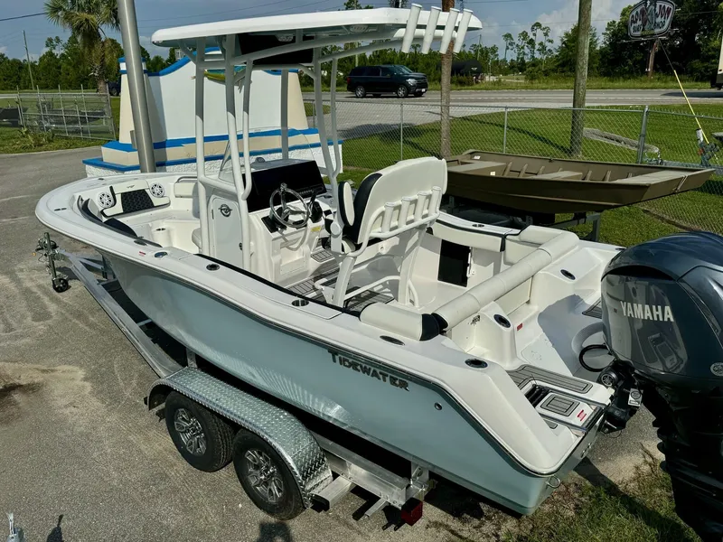 Slide: The Image of 2025 Tidewater 210 LXF boat on trailer with Yamaha engine, parked outdoors. - 7