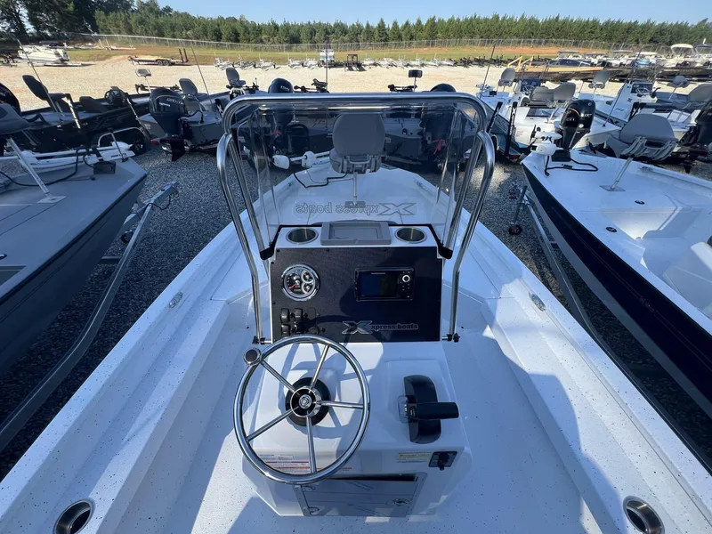 Slide: The Image of 2025 Xpress Hyper-Lift Series H20B boat console with steering wheel and controls. - 3