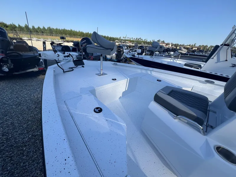 Slide: The Image of 2025 Xpress Hyper-Lift Series H20B boat with new console, parked outdoors. - 4