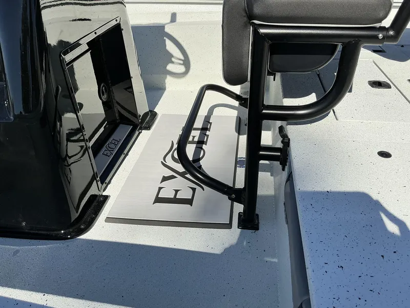 Slide: The Image of 2025 Excel Bay Pro 203 ELITE boat interior with seating and logo detail. - 8