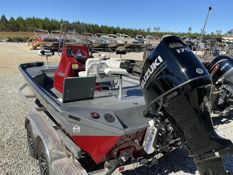 Slide: The Image of 2025 Excel Bay Pro 220 ELITE boat with Suzuki 175 engine on trailer. - 11