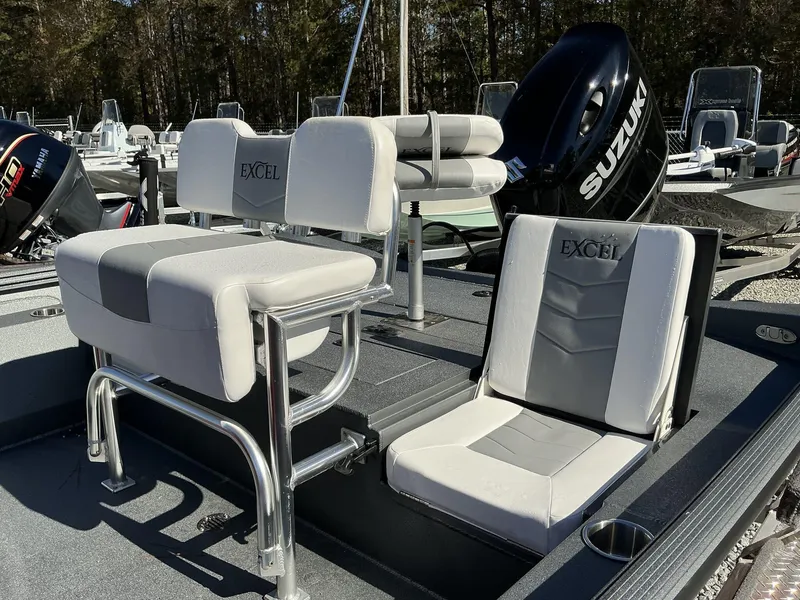Slide: The Image of 2025 Excel Bay Pro 220 ELITE boat with Suzuki engine, featuring comfortable seating. - 6