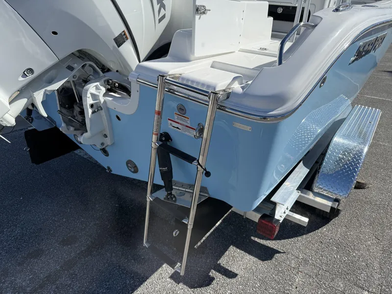Slide: The Image of 2025 Sea Pro 222 boat rear view with ladder and trailer. - 4