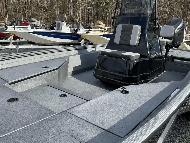 Slide: The Image of 2025 Excel New Bay Pro 230 SEADECK boat, sleek design, spacious deck, modern console. - 11