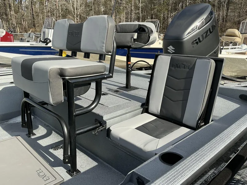 Slide: The Image of 2025 Excel New Bay Pro 230 SEADECK boat interior with seating and Suzuki engine. - 8