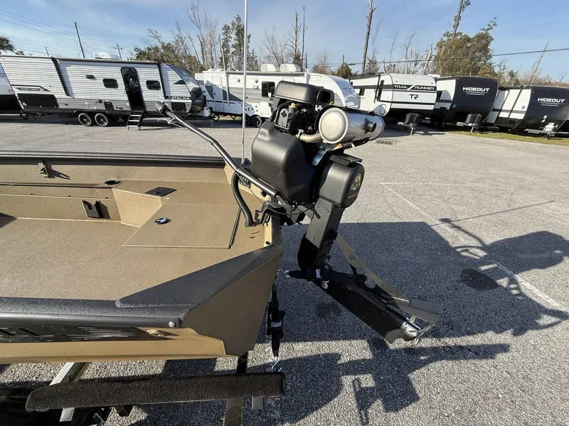 Slide: The Image of 2025 Excel 1754 Eclipse boat with Mud Buddy Mini 40 motor in a parking lot. - 8